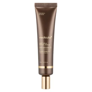 A dark bronze tube of Medicube Deep Vita A Retinol Serum with gold accent bands and a gold cap.