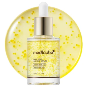 Clear dropper bottle filled with Medicube Deep Vita C Capsule Serum showing yellow Vitamin C capsules suspended in formula.