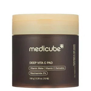 A front view of the Medicube Deep Vita C Pad container with a yellow lid and dark translucent body.