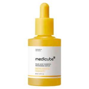 A matte yellow dropper bottle of Medicube Kojic Acid Turmeric Niacinamide Serum isolated on a plain white background.