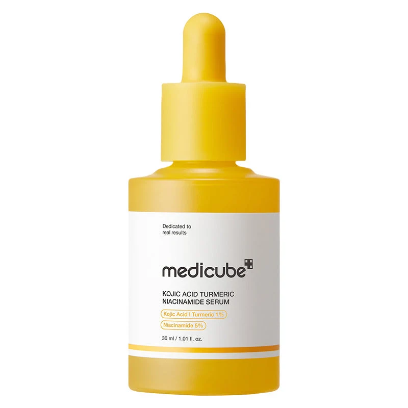 A matte yellow dropper bottle of Medicube Kojic Acid Turmeric Niacinamide Serum isolated on a plain white background.