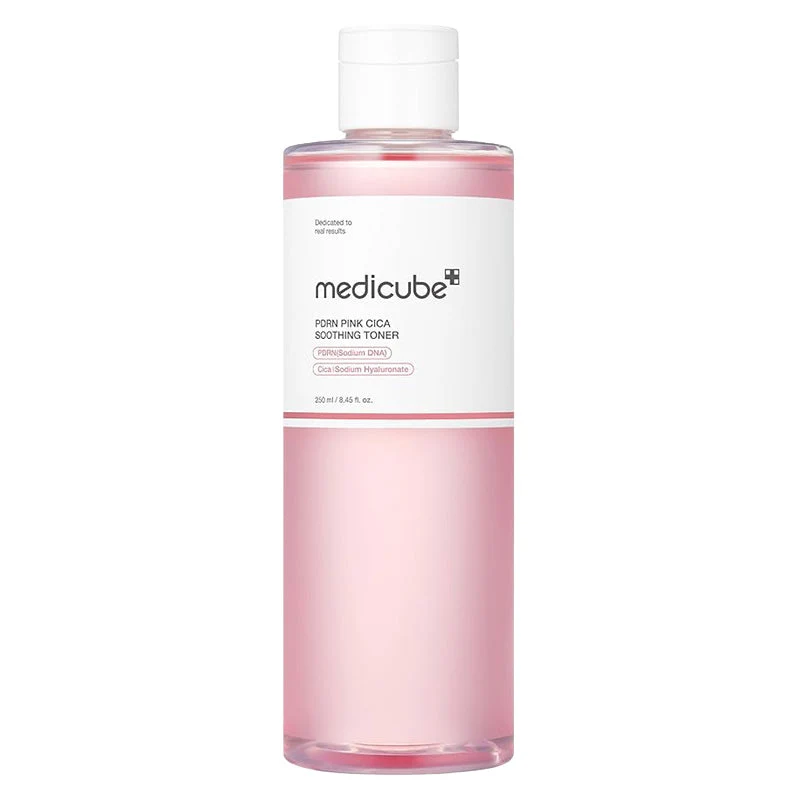 A clear cylindrical bottle filled with translucent pink liquid Medicube PDRN Pink Cica Soothing Toner with a white cap.