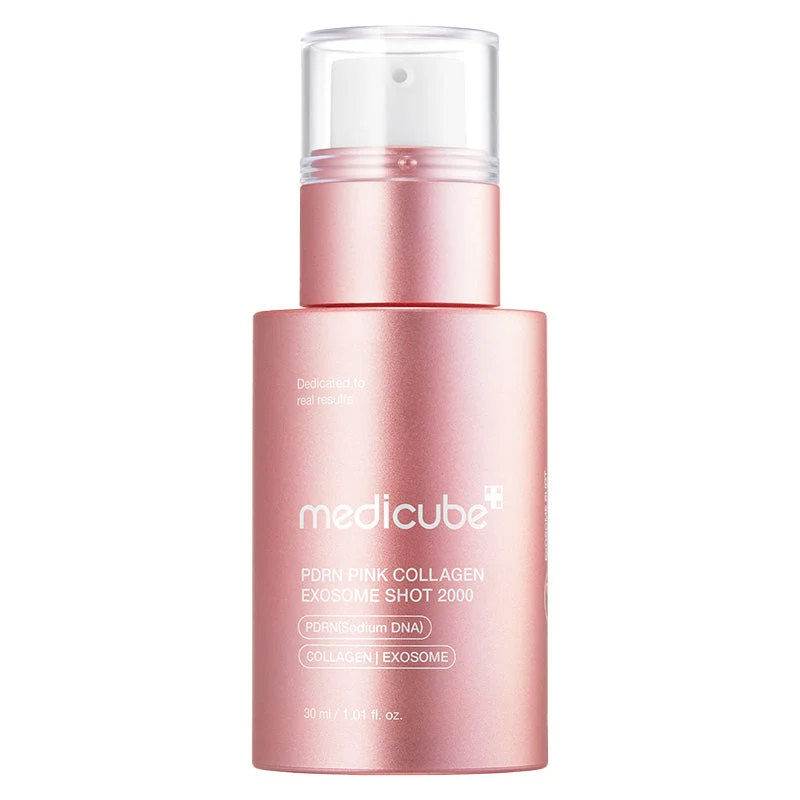An upright metallic light pink bottle of Medicube PDRN Pink Collagen Exosome Shot 2000 with a clear pump cap on a white background.