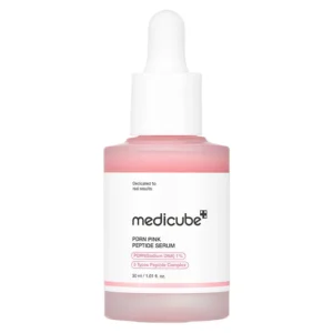A frosted glass dropper bottle filled with pink Medicube PDRN Pink Peptide Serum against a white background.