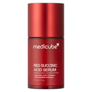 Front view of a translucent deep red cylindrical bottle of Medicube Red Succinic Acid Serum with a matching red cap on a white background.
