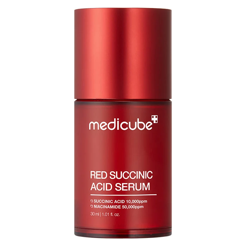 Front view of a translucent deep red cylindrical bottle of Medicube Red Succinic Acid Serum with a matching red cap on a white background.