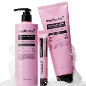 Product lineup featuring Medicube Rosemary PDRN Shampoo, Scalp Serum, and Conditioner surrounded by soapy bubbles.
