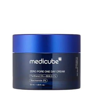 Front view of a dark navy blue jar of Medicube Zero Pore One Day Cream with a metallic blue cap.